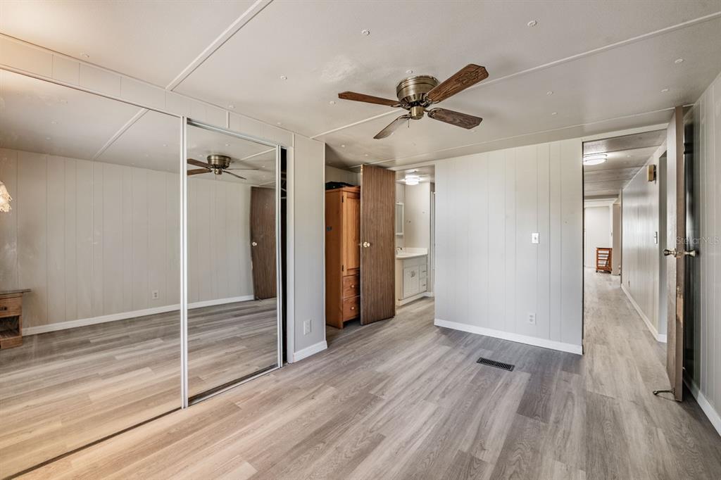 9739 Ray Street Hudson, FL 34669 - Photo 24 of 36 a view of a hallway view with wooden floor and staircase