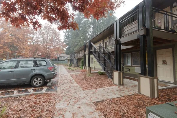 a view of a house with a backyard