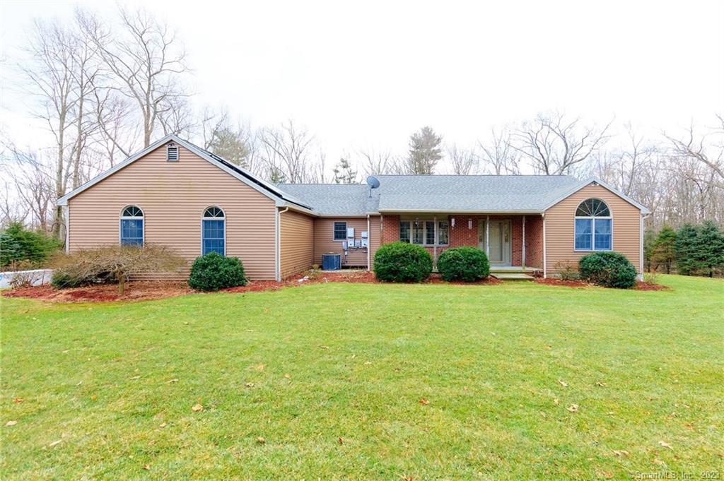 64 Fox Hill Road Pomfret, CT 06259 - Photo 1 of 1 a front view of a house with garden