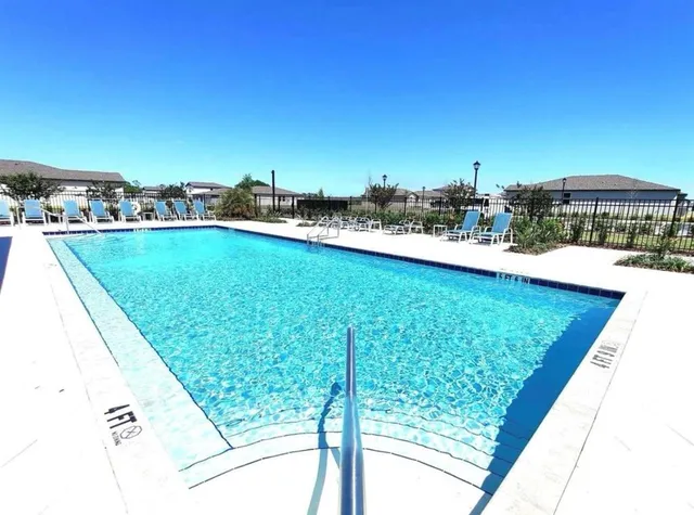 a view of swimming pool from a balcony