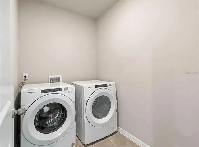 a utility room with dryer and washer