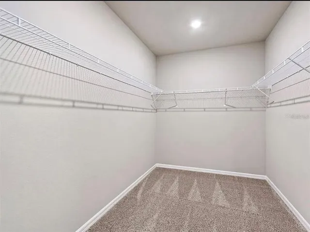 a view of a room with racks on the wall