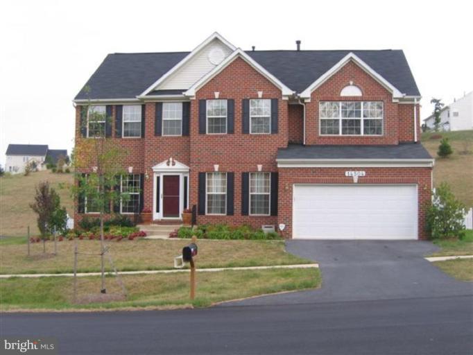 14504 Bubbling Spring Road Boyds, MD 20841 - Photo 1 of 21 front view of a house with a yard