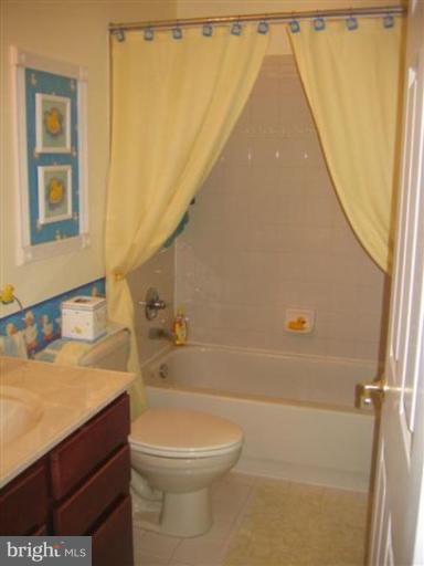14504 Bubbling Spring Road Boyds, MD 20841 - Photo 15 of 21 a bathroom with a sink a toilet and tub