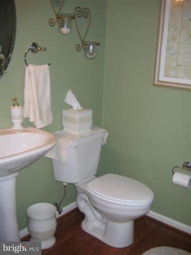 14504 Bubbling Spring Road Boyds, MD 20841 - Photo 16 of 21 a bathroom with a toilet sink and mirror