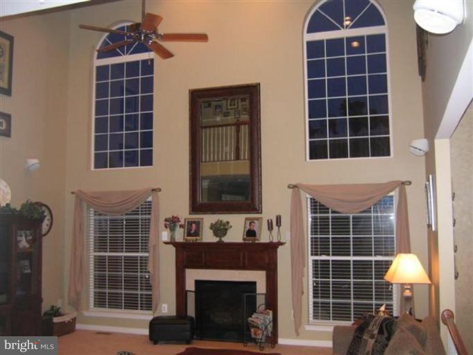 14504 Bubbling Spring Road Boyds, MD 20841 - Photo 6 of 21 a front view of a house with large windows