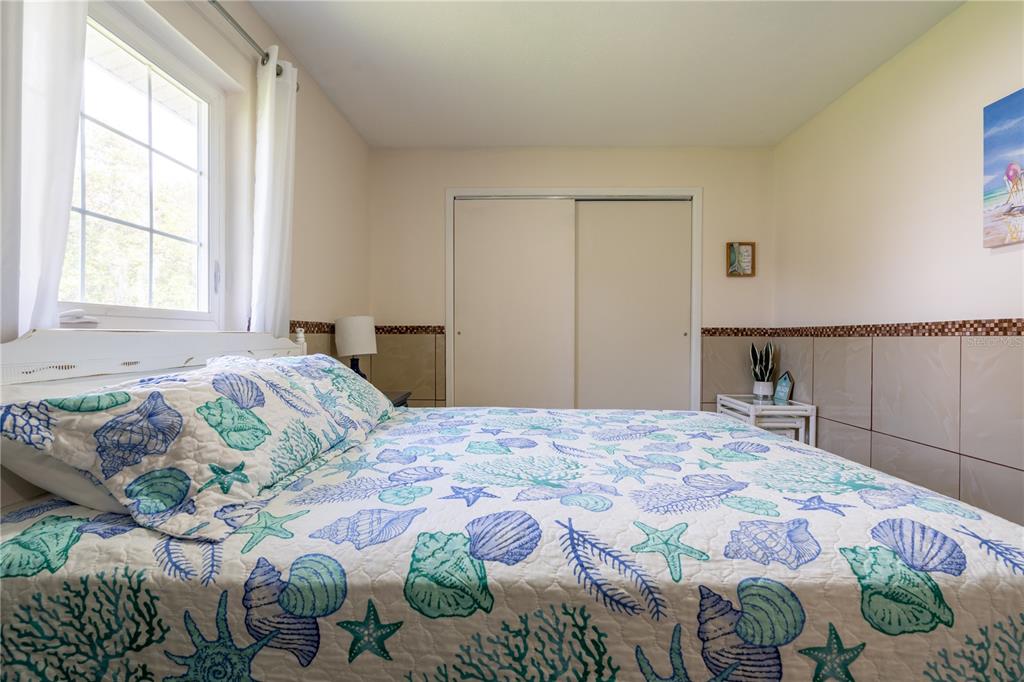 2140 Pinehurst Street Sarasota, FL 34231 - Photo 22 of 40 a bedroom with a bed and a window