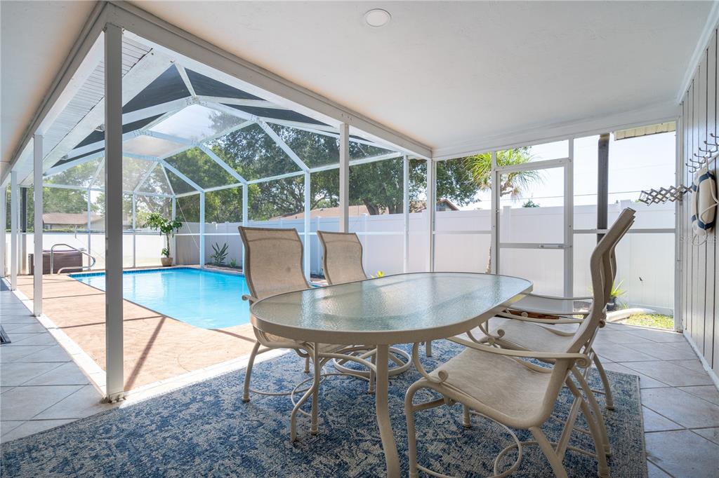 2140 Pinehurst Street Sarasota, FL 34231 - Photo 25 of 40 a dining room with a table and chairs