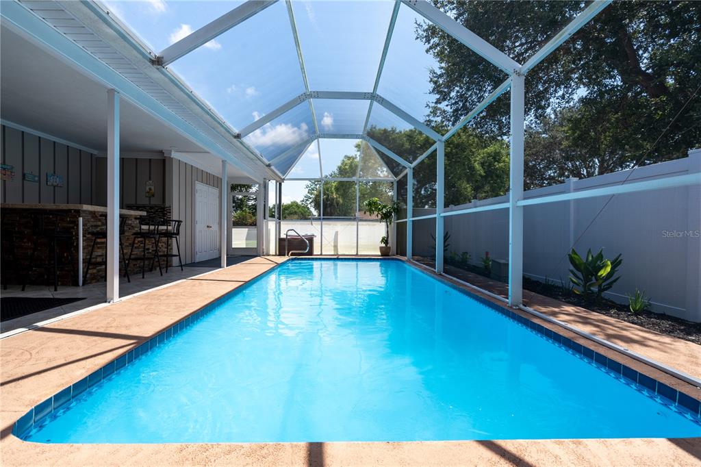 2140 Pinehurst Street Sarasota, FL 34231 - Photo 26 of 40 a view of a backyard with swimming pool