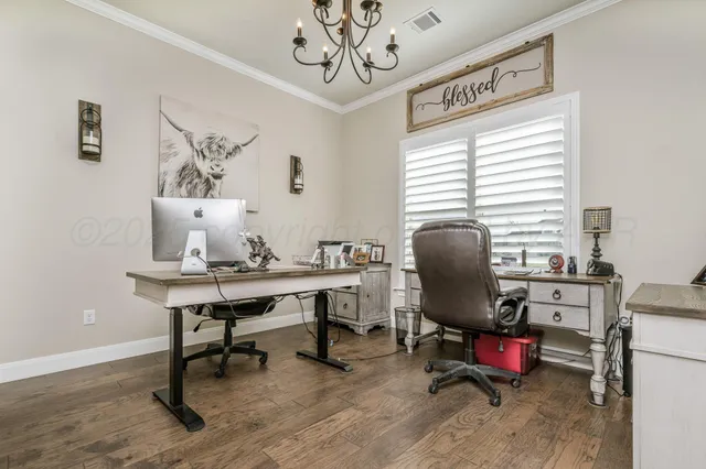 a view of a workspace with furniture