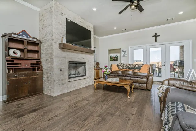 a living room with furniture fireplace and flat screen tv