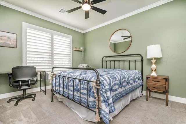 a bedroom with bed and a window