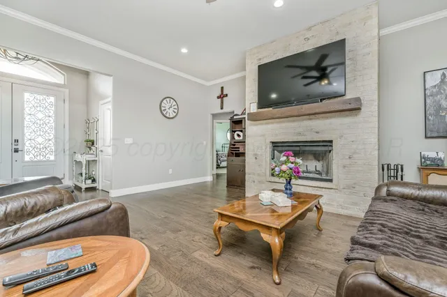 a living room with furniture and a flat screen tv