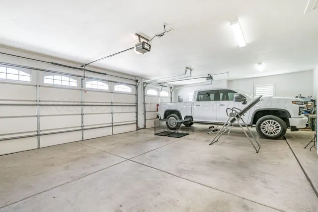 a view of a garage with parked cars