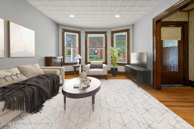 a living room with furniture and a table