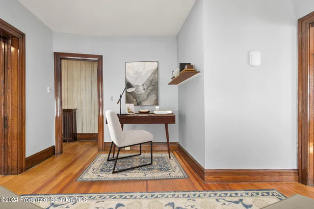 a workspace with furniture and wooden floor