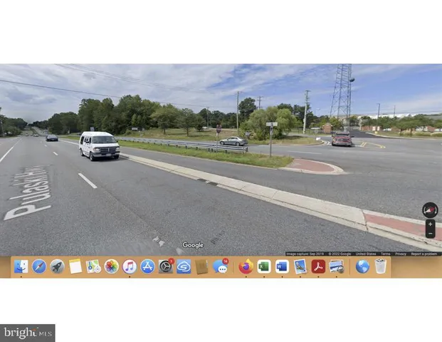 a view of a road with a yard