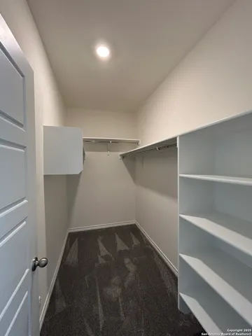 a view of storage and utility room with empty racks