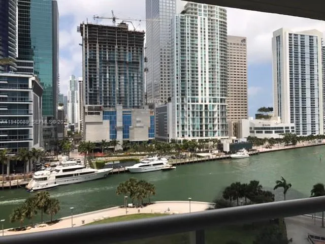 a view of a lake with tall buildings