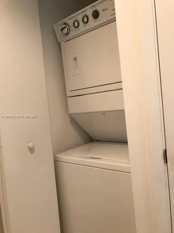 a view of swimming pool with outdoor seating and city view