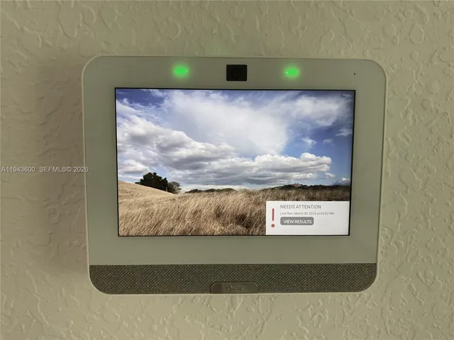 a kitchen with refrigerator a microwave and cabinets