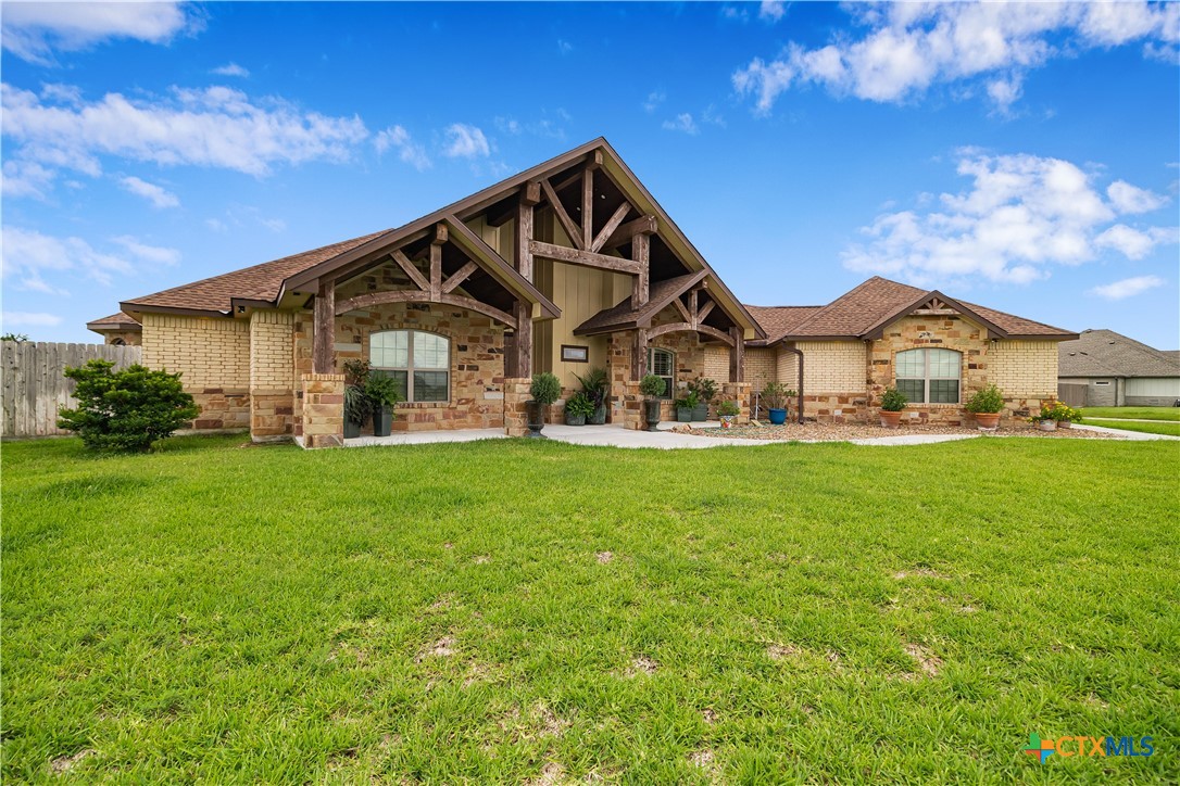 254 Sendera Loop Victoria, TX 77904 - Photo 11 of 48 a front view of a house with garden