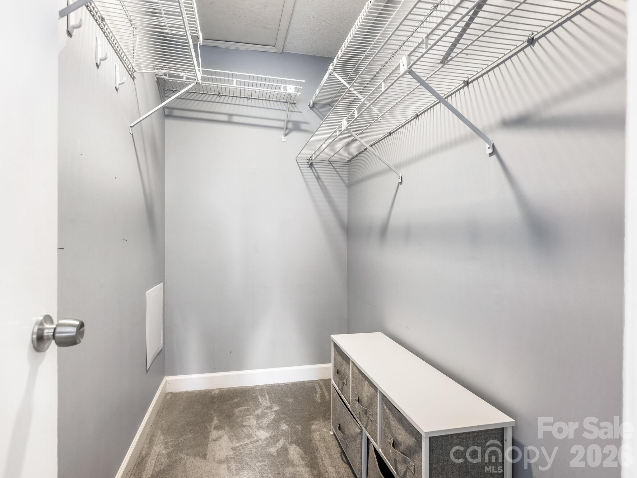 1612 Sharon Road West, Unit 68 Charlotte, NC 28210 - Photo 11 of 18 a view of a room with racks on the wall