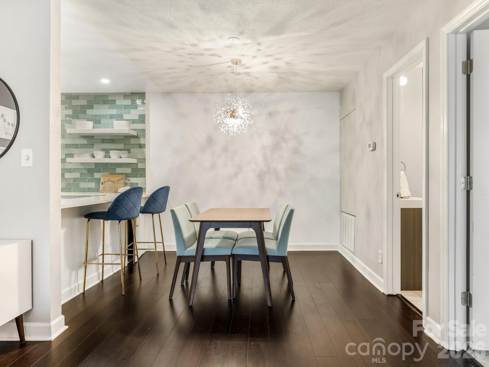 1612 Sharon Road West, Unit 68 Charlotte, NC 28210 - Photo 5 of 18 a view of a dining room with furniture window and wooden floor