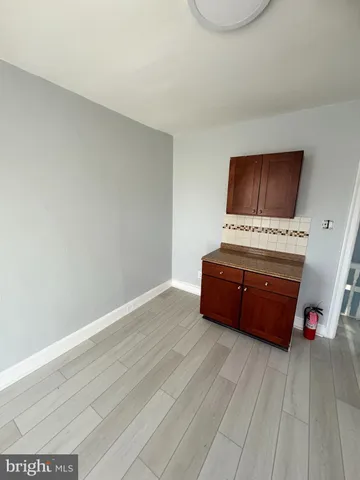 a room with furniture and a flat screen tv