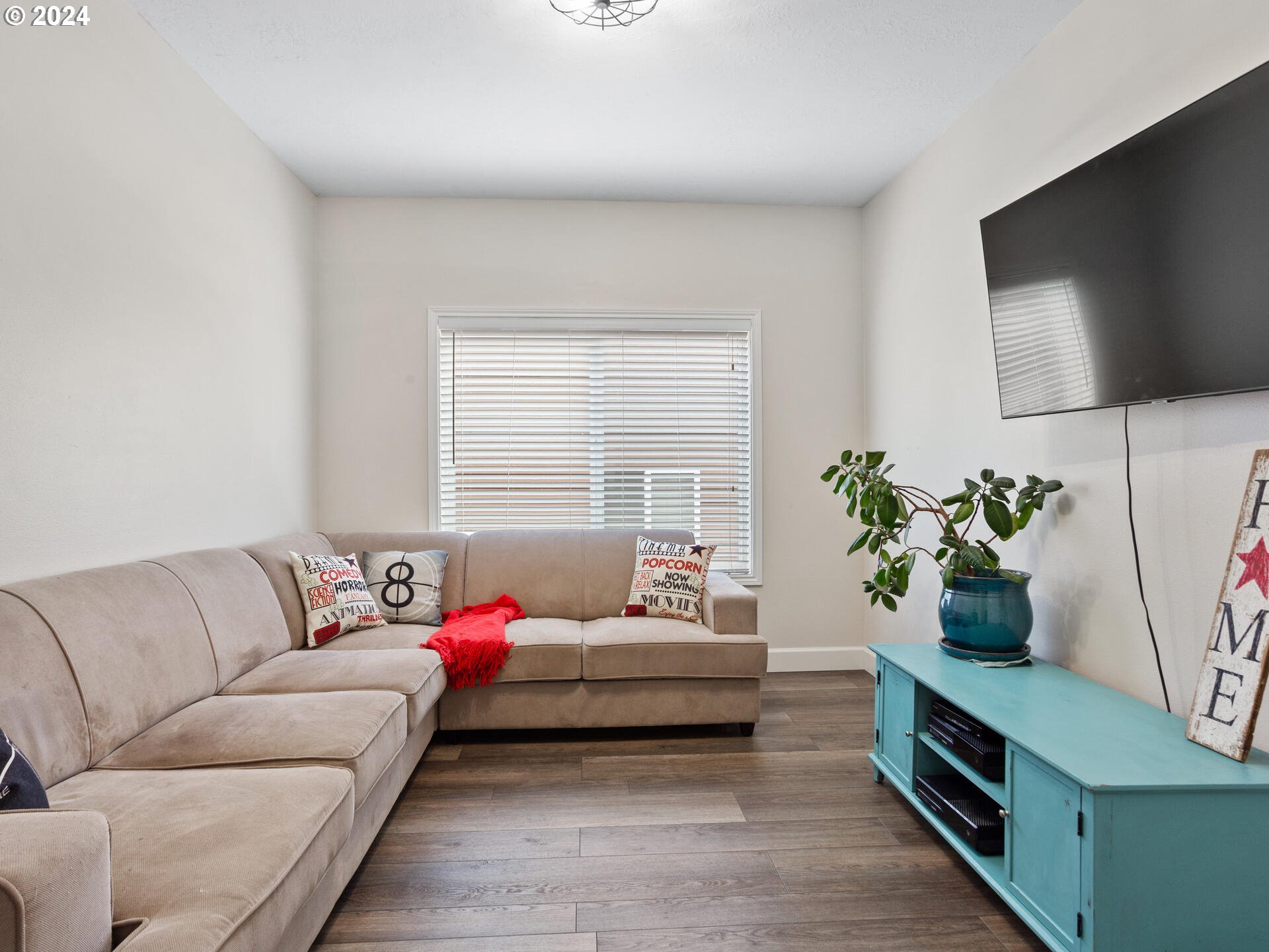 17156 Southeast Macanudo Street Damascus, OR 97089 - Photo 24 of 47 a living room with furniture and a potted plant