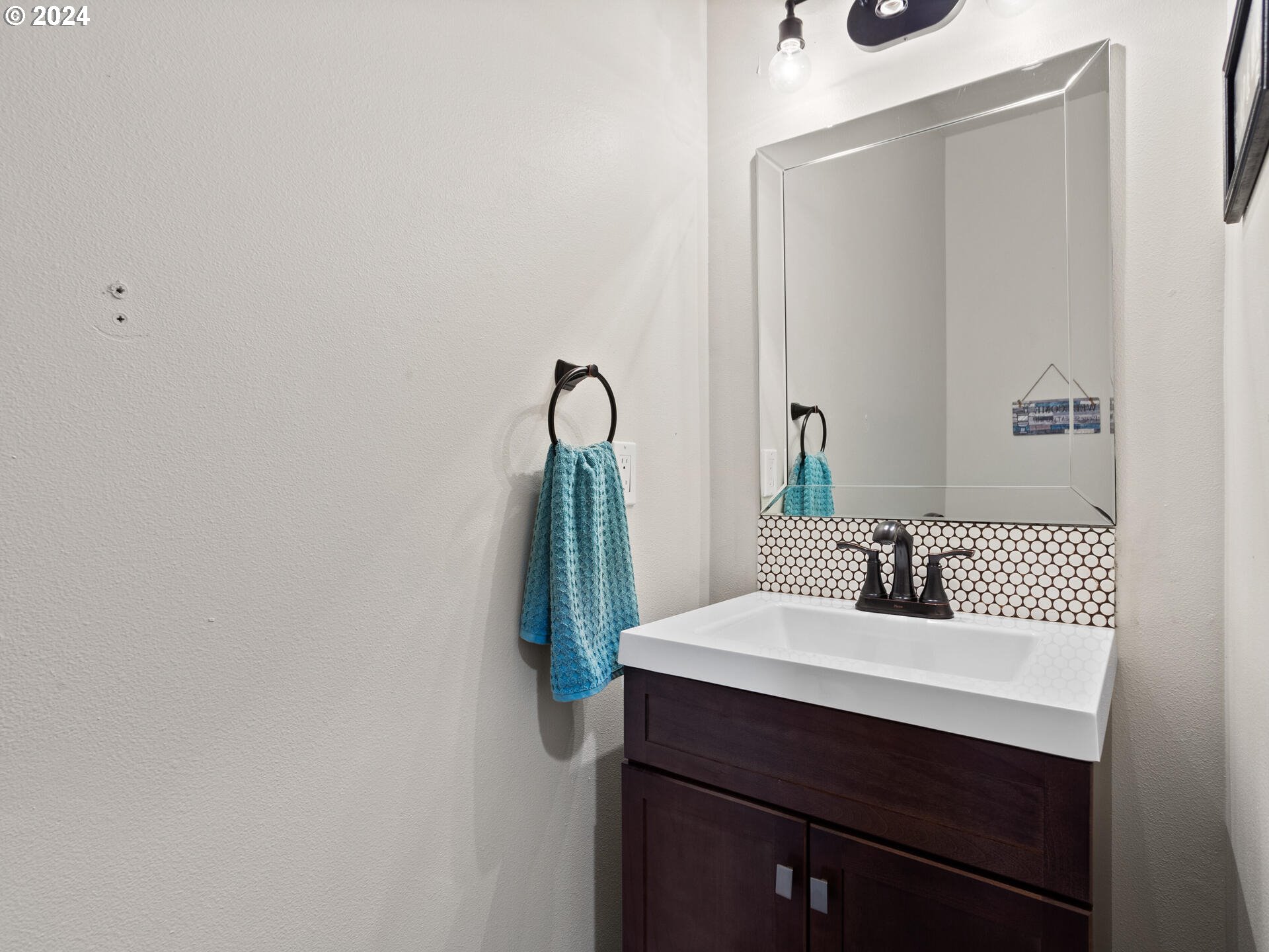 17156 Southeast Macanudo Street Damascus, OR 97089 - Photo 25 of 47 a bathroom with a sink and a mirror