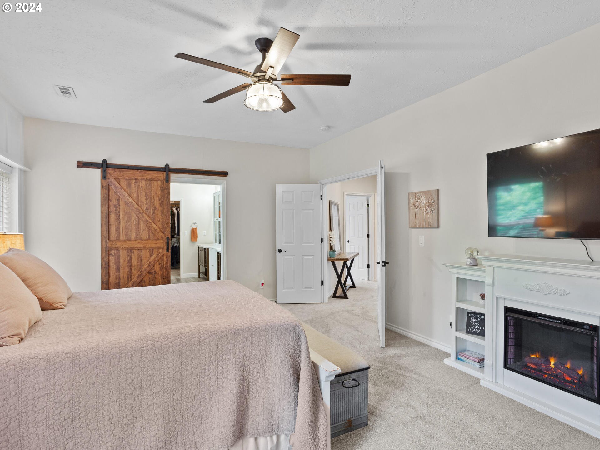 17156 Southeast Macanudo Street Damascus, OR 97089 - Photo 28 of 47 a bedroom with a bed and a flat screen tv