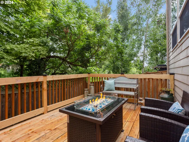 a view of a wooden deck with furniture