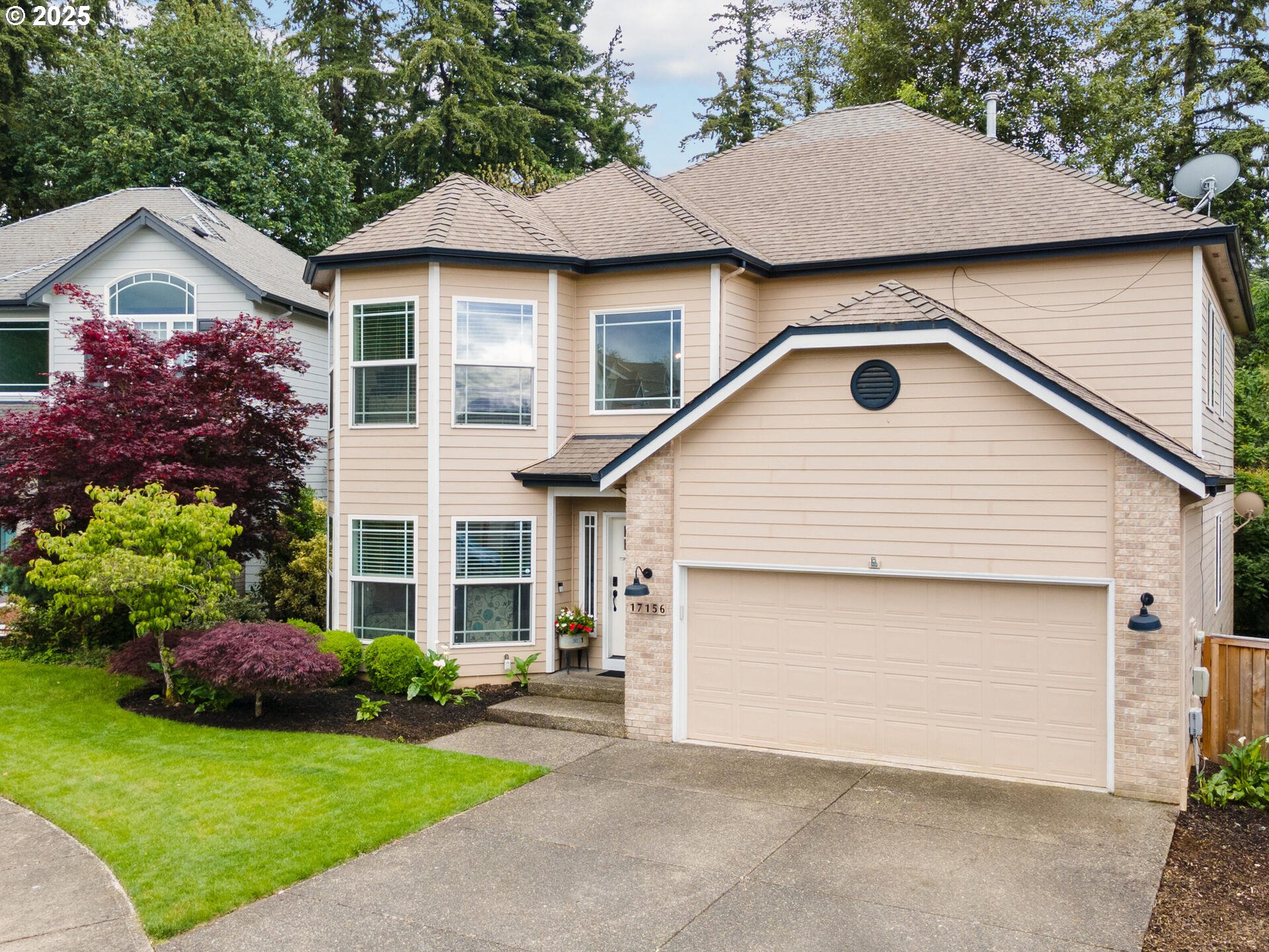 17156 Southeast Macanudo Street Damascus, OR 97089 - Photo 4 of 47 a view of a yard in front view of a house