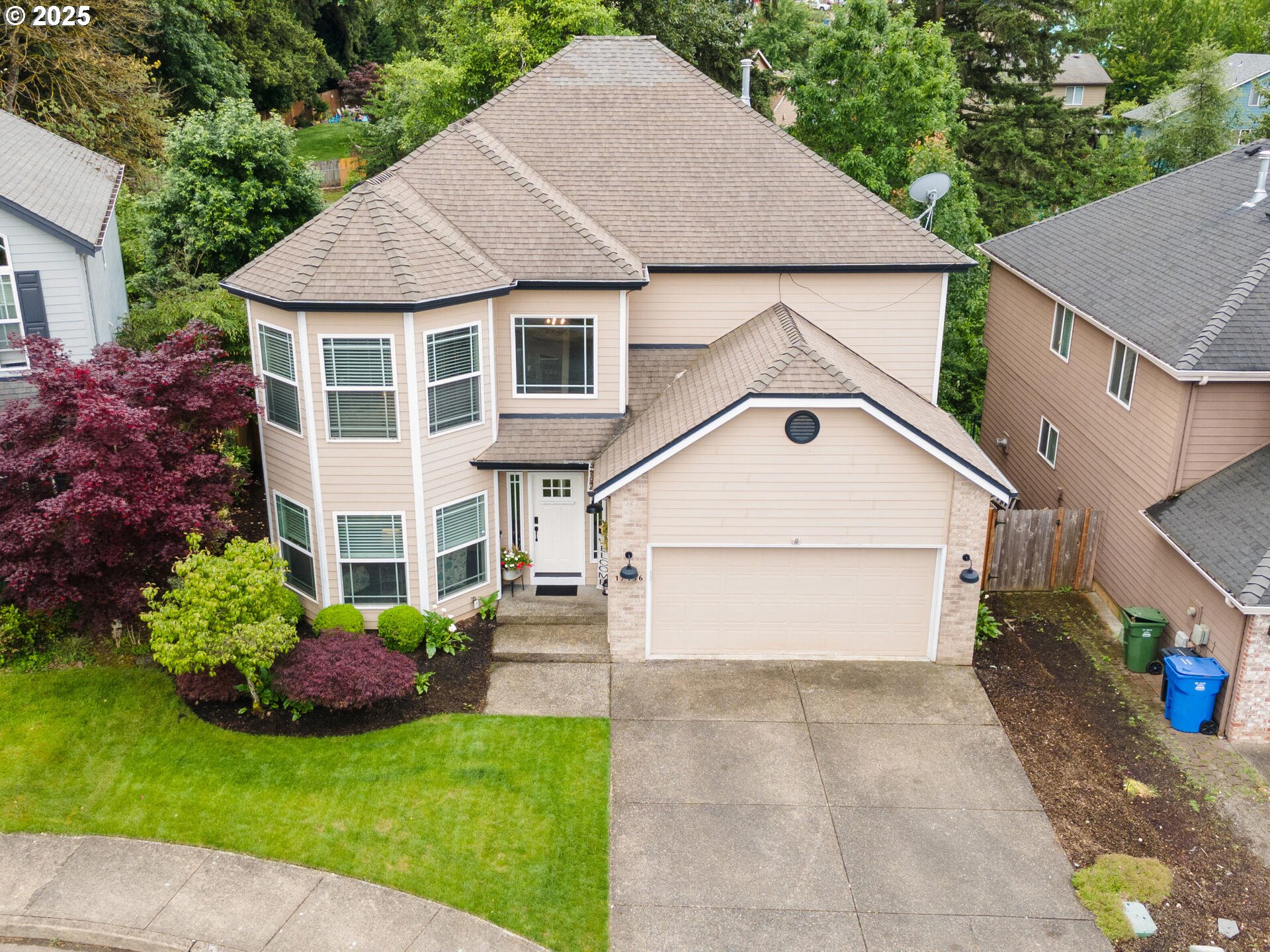 17156 Southeast Macanudo Street Damascus, OR 97089 - Photo 5 of 47 a view of a house with garden