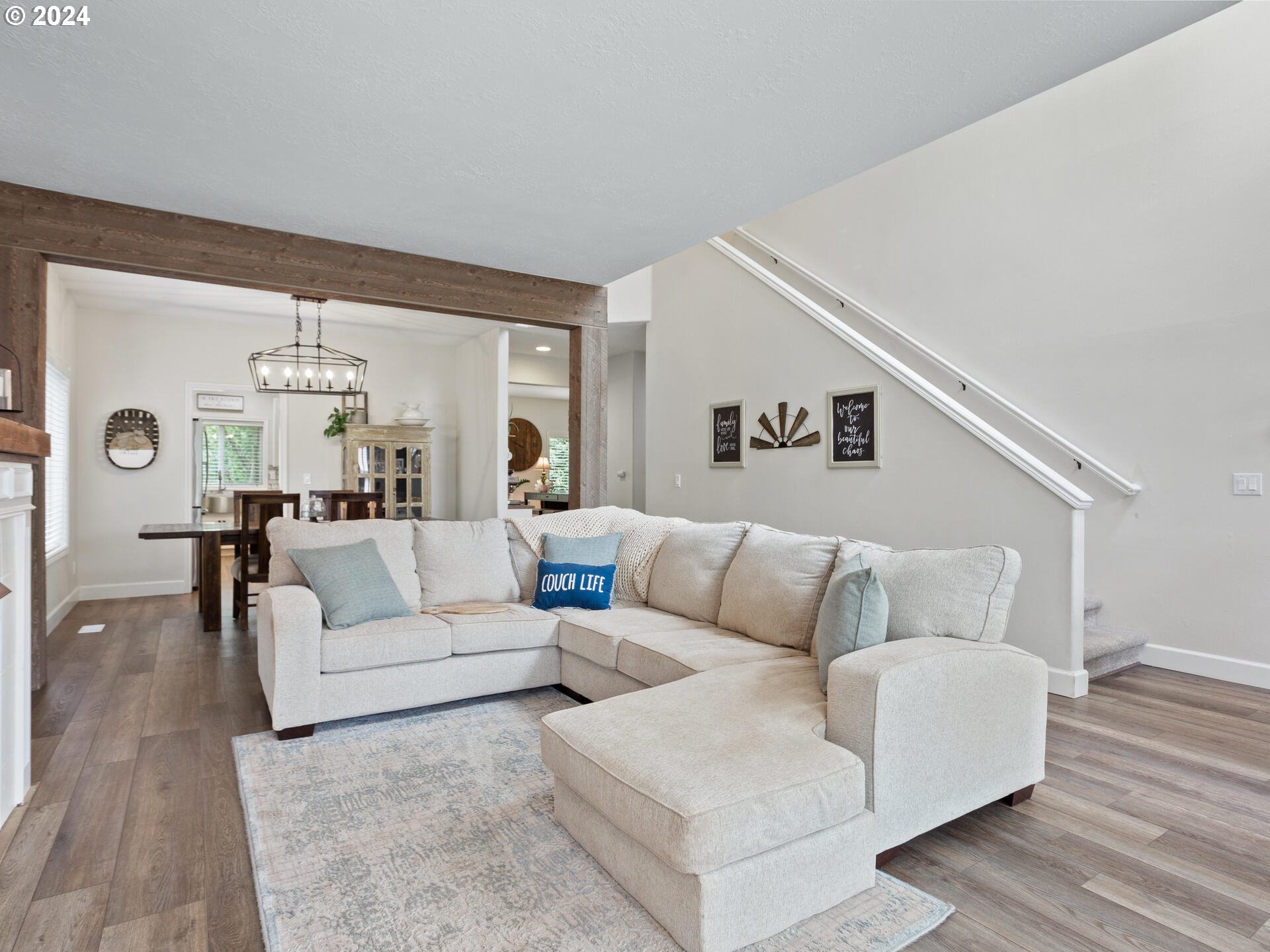 17156 Southeast Macanudo Street Damascus, OR 97089 - Photo 6 of 47 a living room with furniture and a large window
