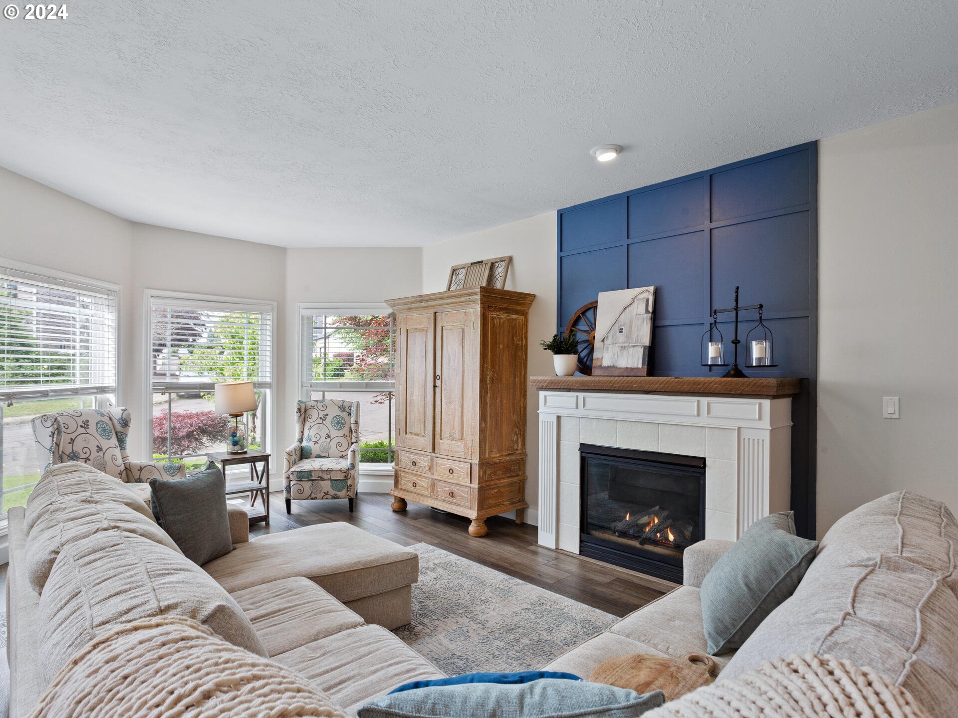 17156 Southeast Macanudo Street Damascus, OR 97089 - Photo 9 of 47 a living room with furniture and a fireplace
