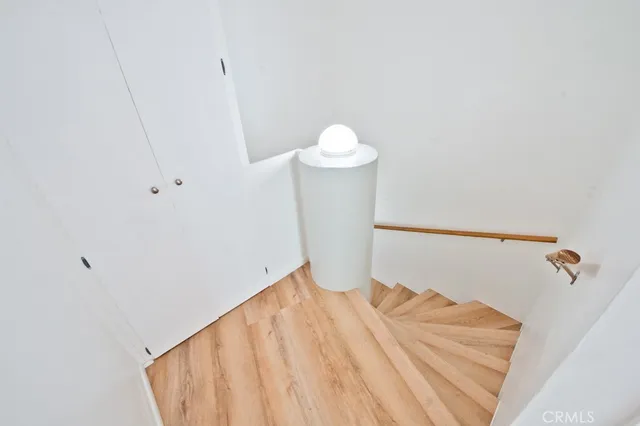 a view of a room with wooden floor