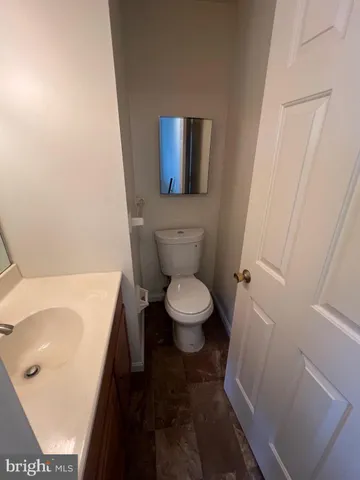 a bathroom with a toilet and a sink