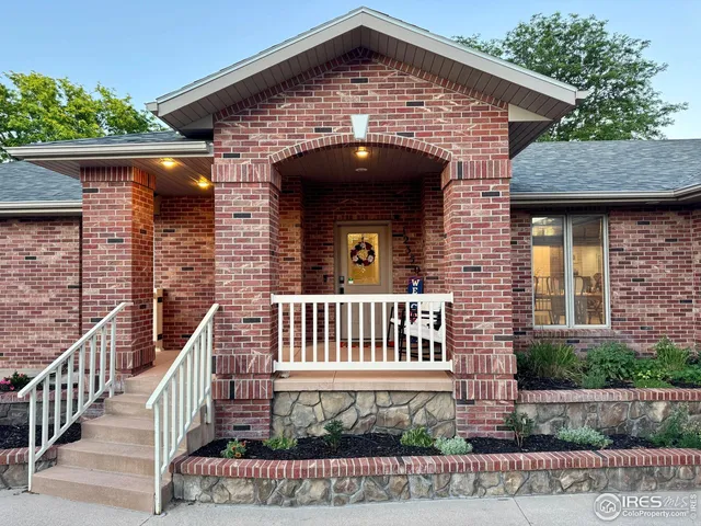 a front view of a house with a porch