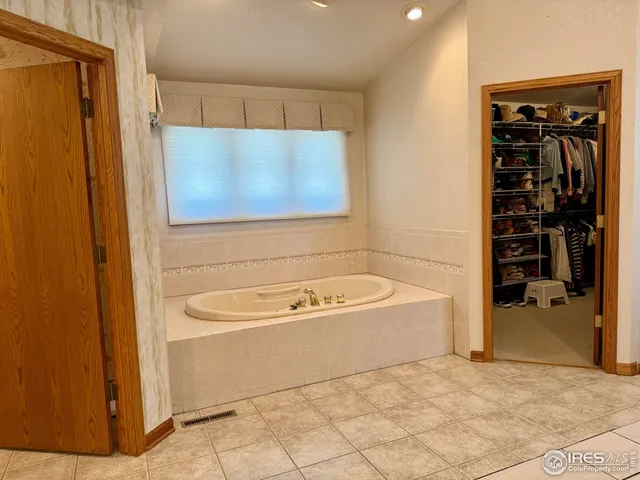 a kitchen with stainless steel appliances a refrigerator and cabinets