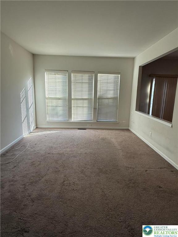 1805 Hemming Way Orefield, PA 18069 - Photo 12 of 24 a view of an empty room with wooden floor and a window