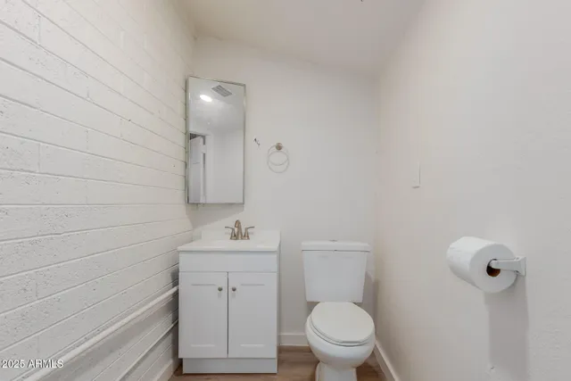 a bathroom with a sink toilet and vanity
