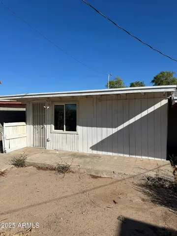 a view of a backyard of a house