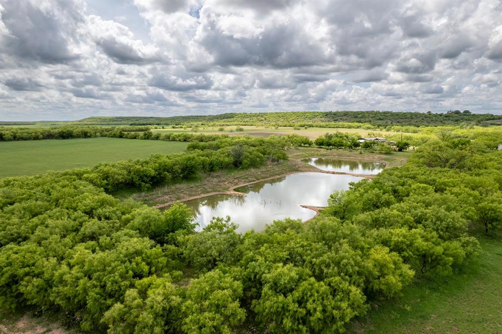 a view of a lake with a yard