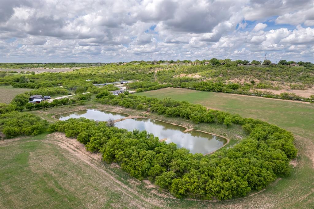 Tbd Memory Lake Road Coleman, TX 76834 - Photo 29 of 38 a view of a lake with a building in the background