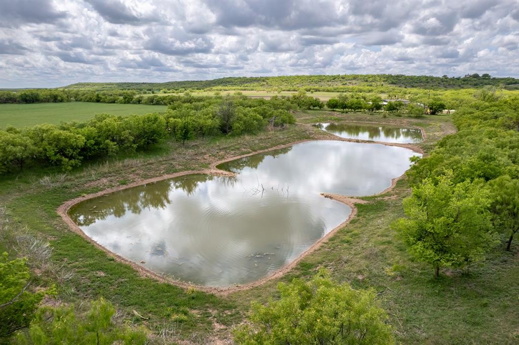 Tbd Memory Lake Road Coleman, TX 76834 - Photo 3 of 38 a view of a lake with a yard