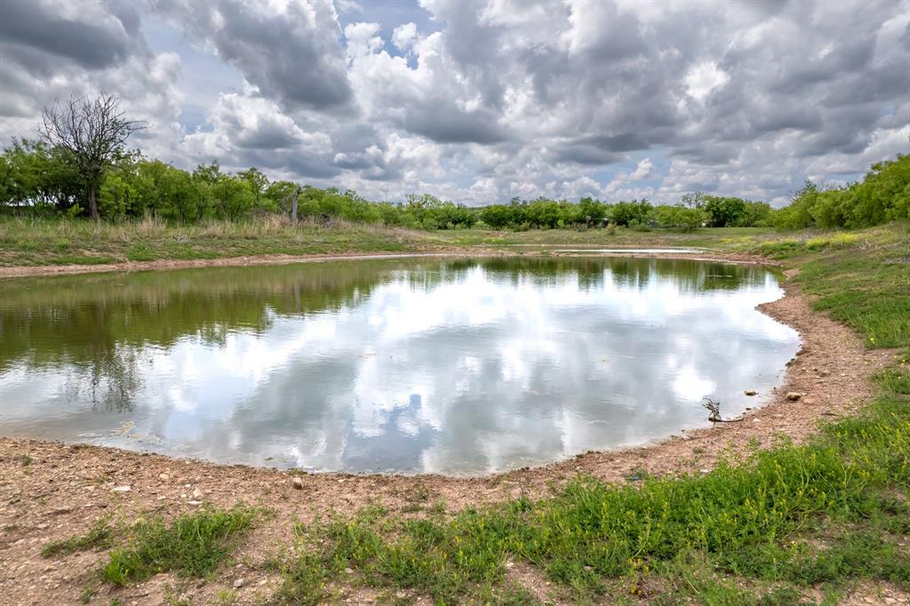 Tbd Memory Lake Road Coleman, TX 76834 - Photo 6 of 38 a view of a lake with a yard and large trees