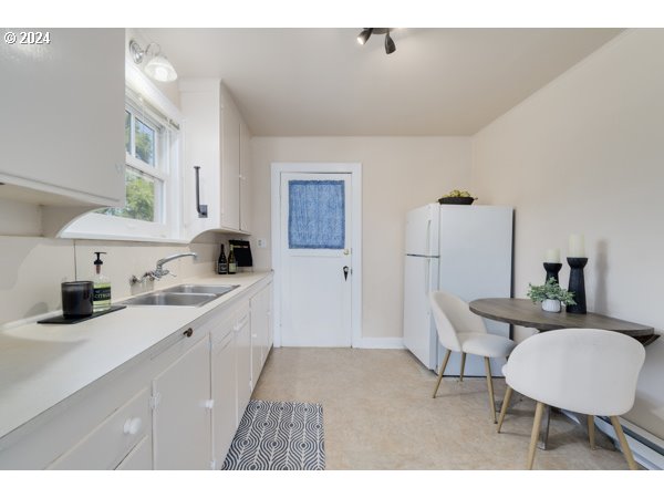 647 5th Street Springfield, OR 97477 - Photo 11 of 40 a kitchen with a sink cabinets and wooden floor
