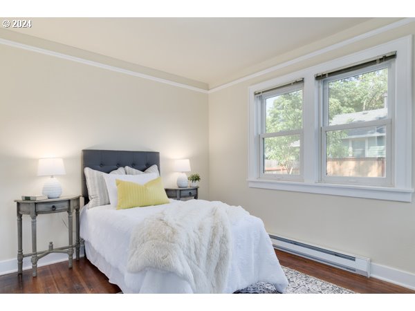 647 5th Street Springfield, OR 97477 - Photo 21 of 40 a bedroom with a bed and a night stand